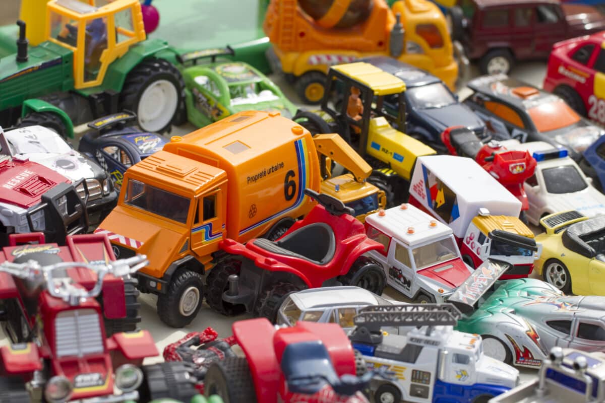 tons of plastic toys and kid cars in display at flea market